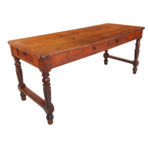 Oak farm table with two drawers, resting on turned legs joined  By a cross brace