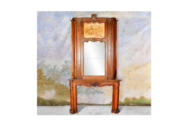 Antique oak mantel with cherubs overmantel